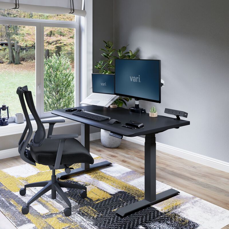 Electric Standing Desk 48x30 Black in lowered position at home image number null